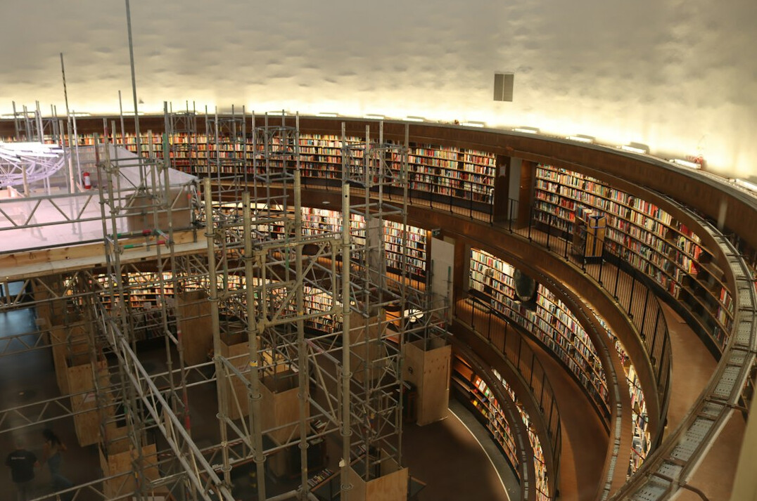 Grand reading room with curved shelves and books