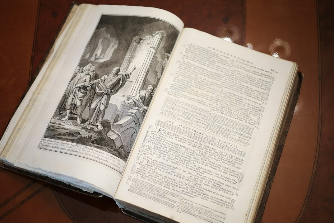 Open old book on a wooden table