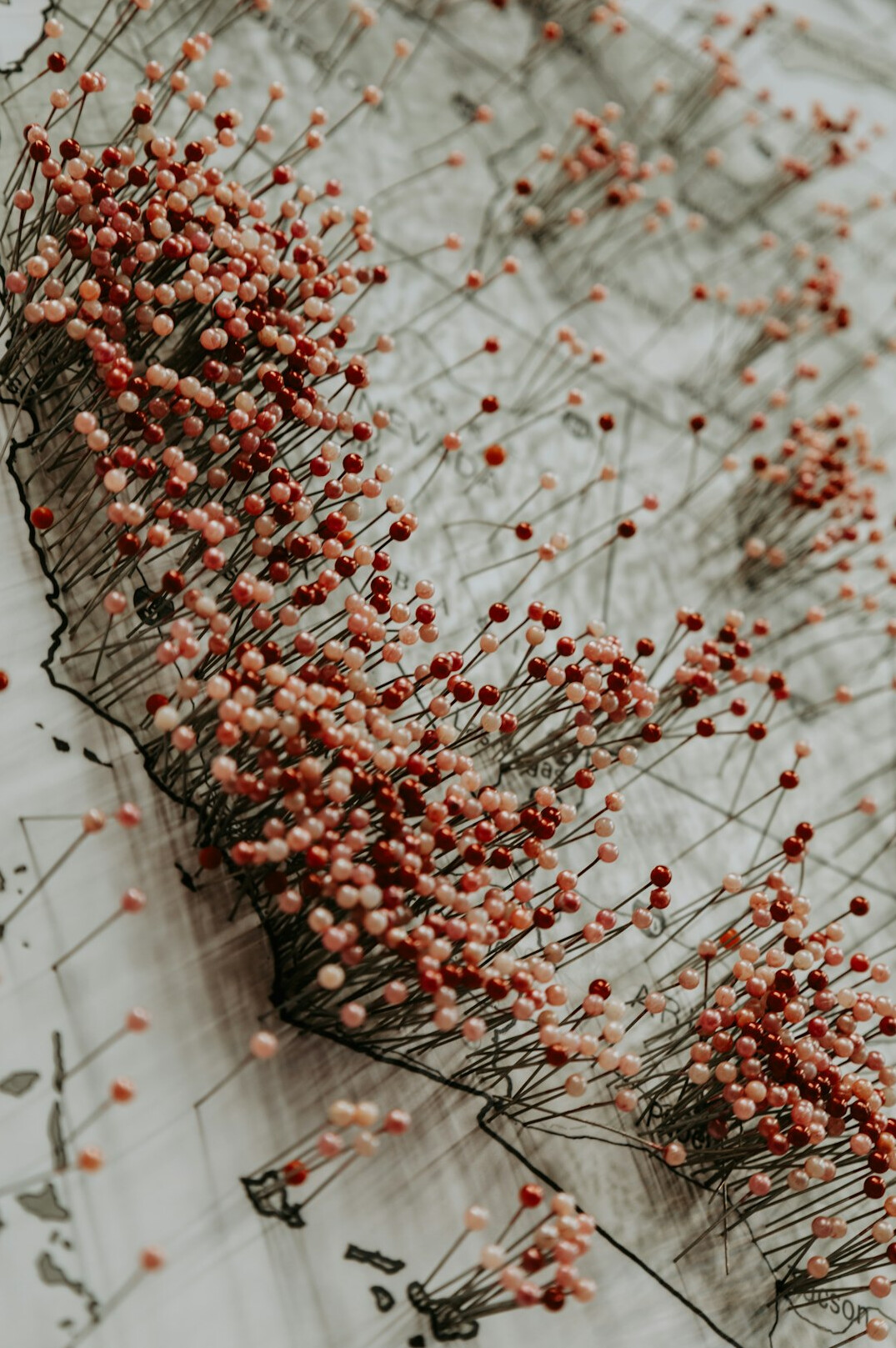 old map on table with pins