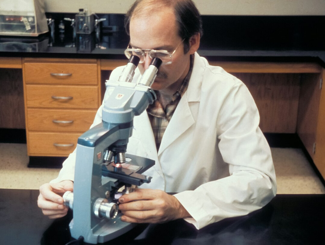 forensic scientist analyzing old paper