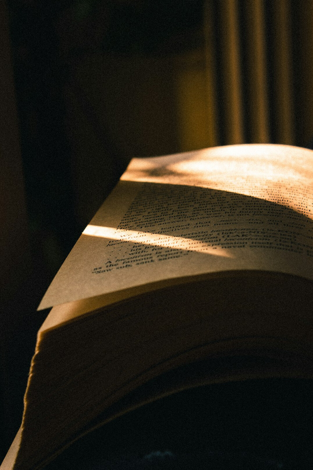 Open book with pages lit by warm light